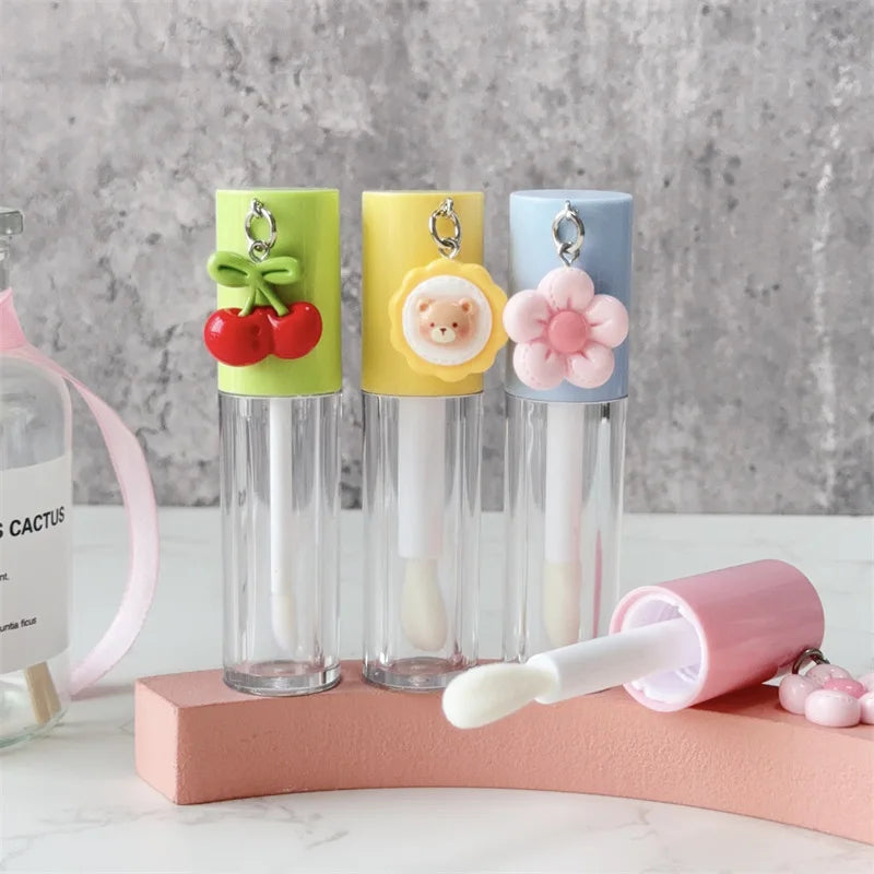 6ml Cute Lipgloss Tube Custom Logo Plastic Lip Gloss Tubes with Pendant and Brush Lip Glaze Cosmetic Packaging Wholesale Vue
