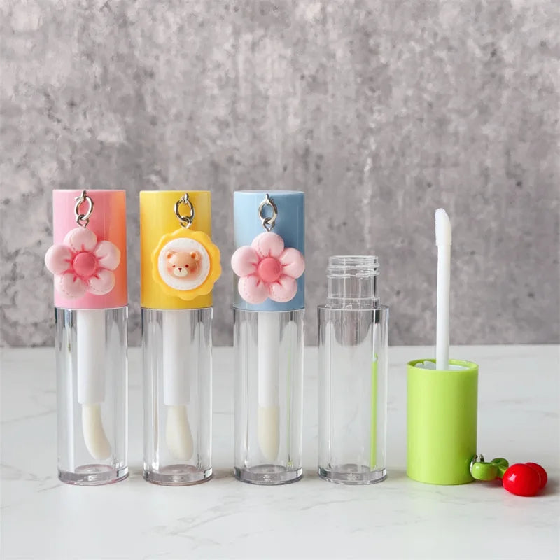 6ml Cute Lipgloss Tube Custom Logo Plastic Lip Gloss Tubes with Pendant and Brush Lip Glaze Cosmetic Packaging Wholesale Vue