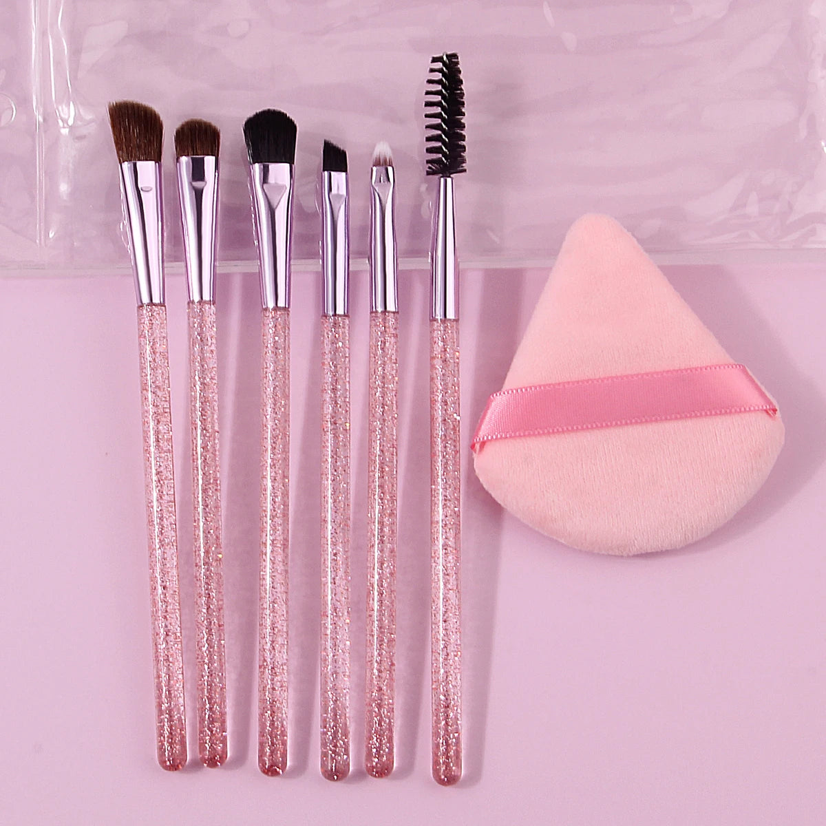 6pcs soft bristle multi-functional eye brush with glitter handle +1pcs triangular powder puff +1pcs portable pvx storage bag Vue