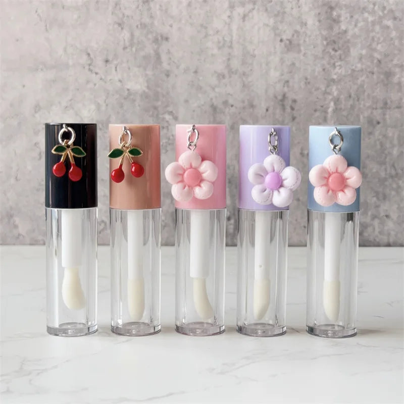 6ml Cute Lipgloss Tube Custom Logo Plastic Lip Gloss Tubes with Pendant and Brush Lip Glaze Cosmetic Packaging Wholesale Vue