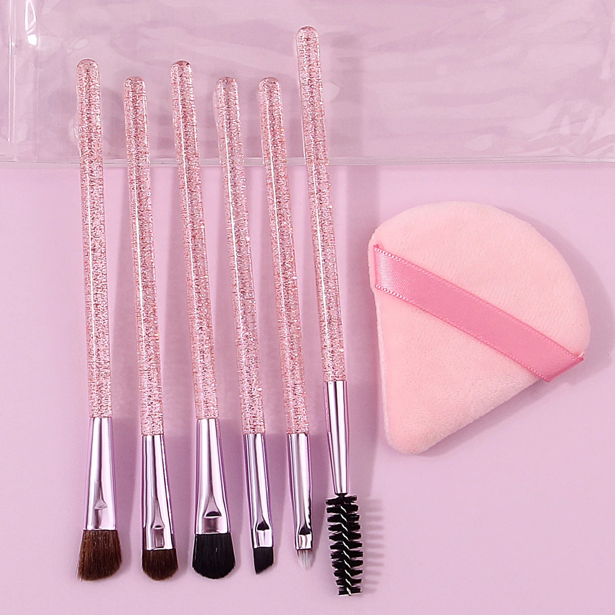 6pcs soft bristle multi-functional eye brush with glitter handle +1pcs triangular powder puff +1pcs portable pvx storage bag Vue