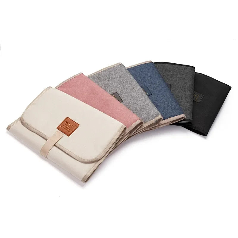 vvocci Portable baby changing mat; multifunctional storage baby changing station; waterproof for mother and baby. Vue